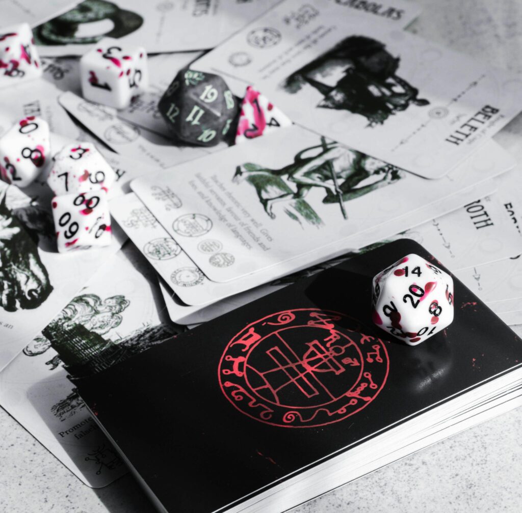 A close-up view of tabletop gaming cards and colorful dice, perfect for game enthusiasts.